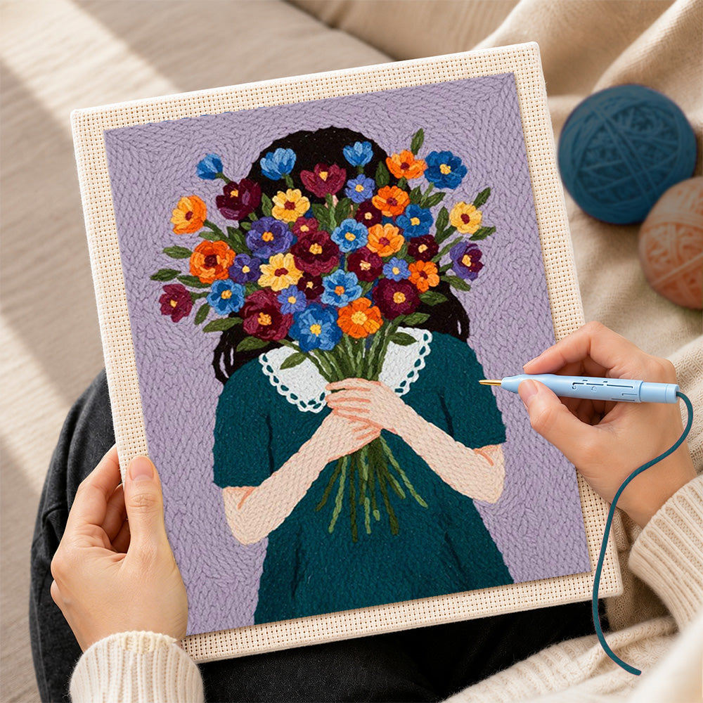 Creating handmade woman holding flowers face hidden punch needle artwork