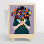 Woman holding flowers face hidden punch needle kit for beginners