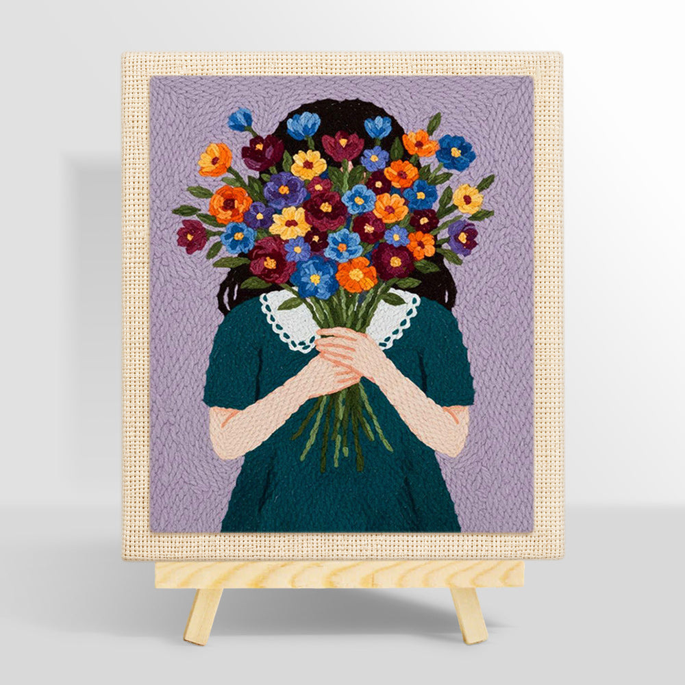 Woman holding flowers face hidden punch needle kit for beginners
