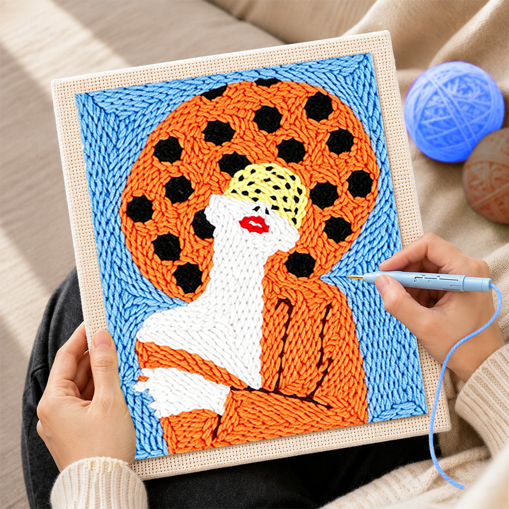 Creating handmade woman with red lips in orange punch needle artwork