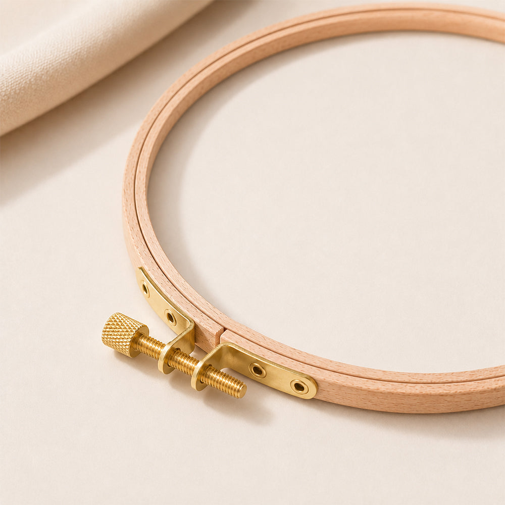 Close-up detail of wooden embroidery hoop with metal screw fastening