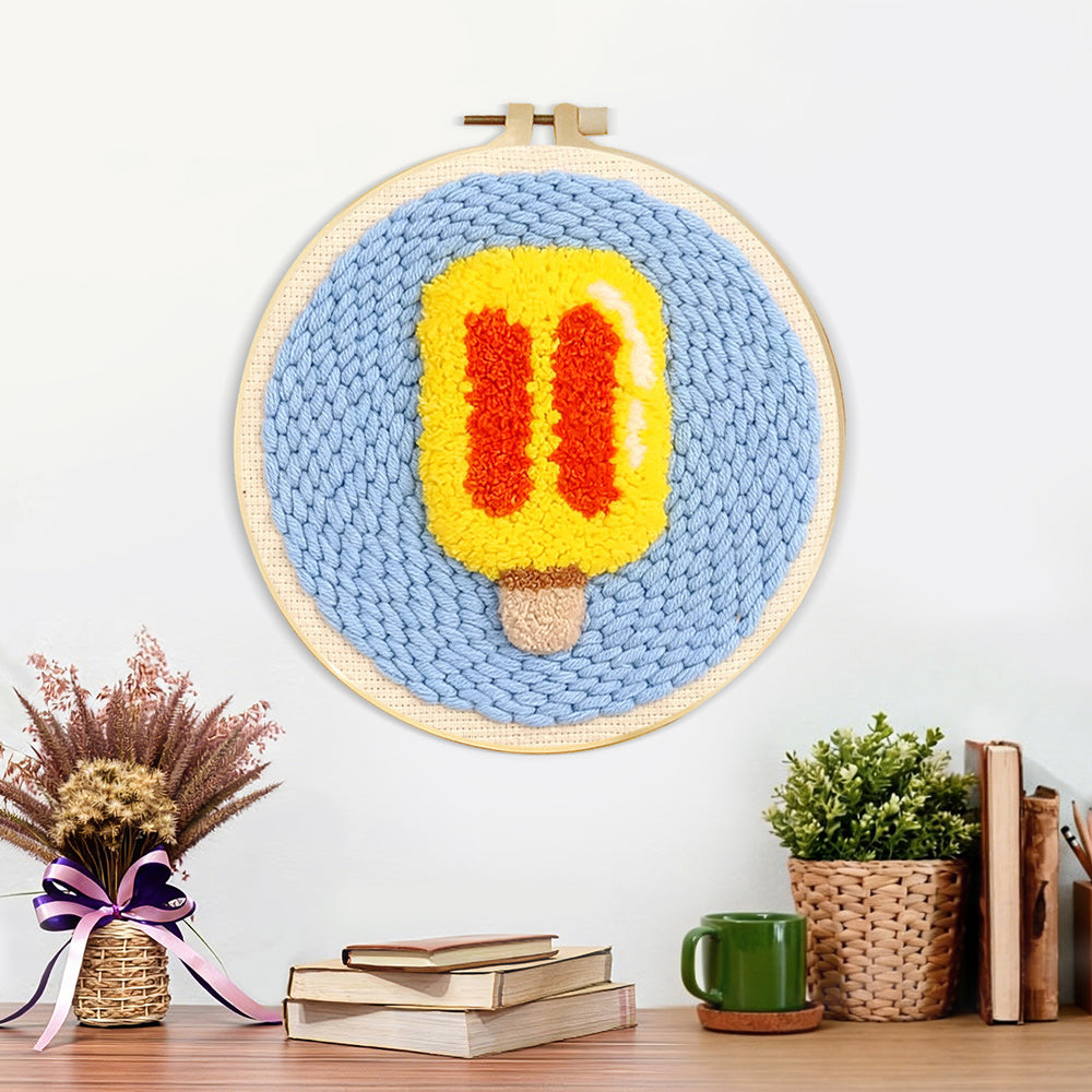 Finished yellow and red ice lolly artwork displayed on a wall