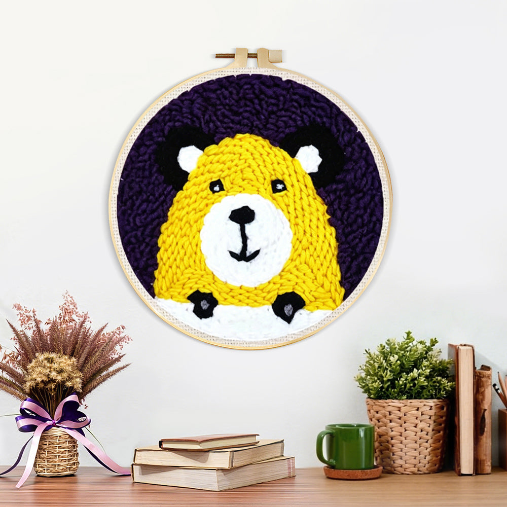 Finished yellow bear face artwork displayed on a wall