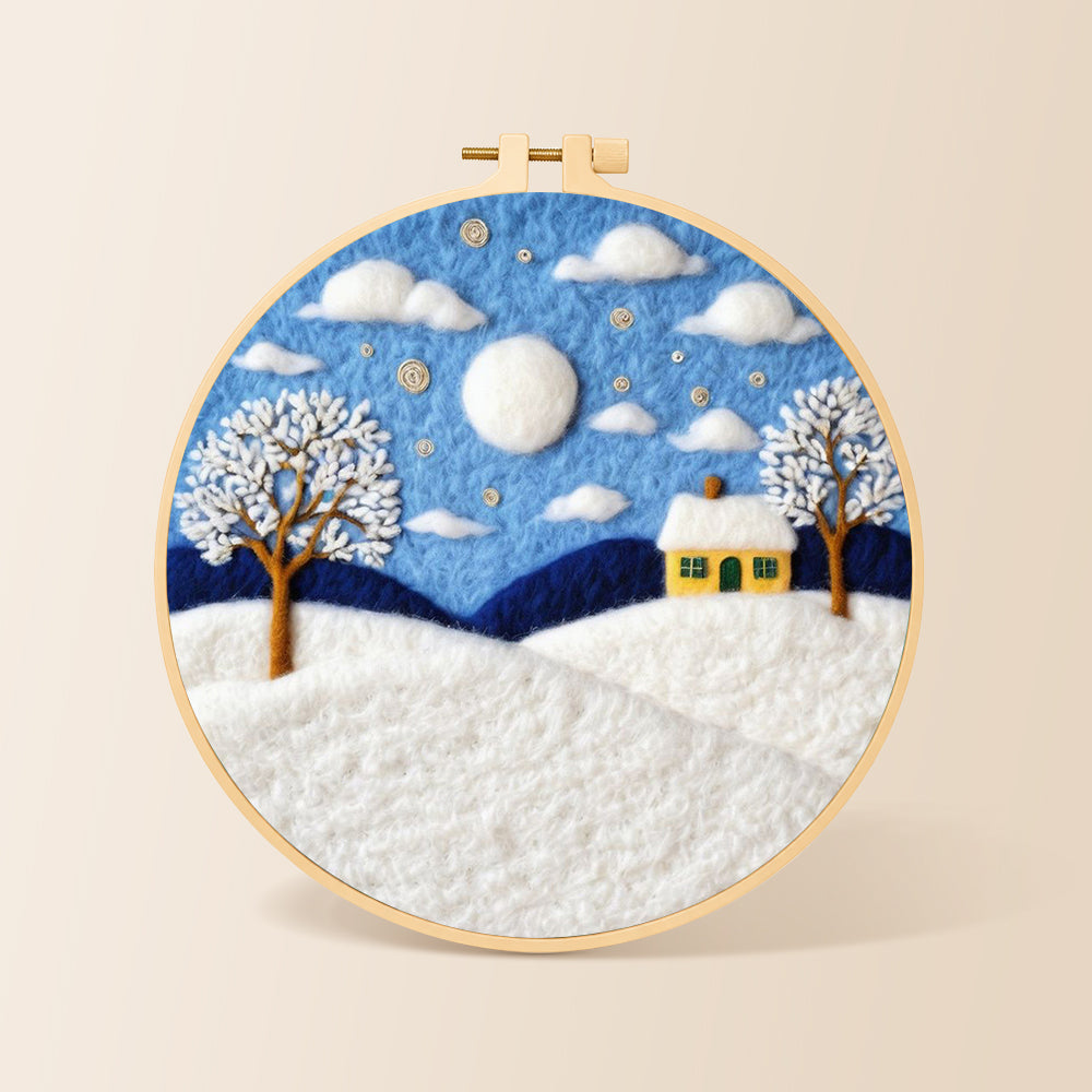 Yellow cottage in the snow needle felting kit for beginners with a round wooden frame