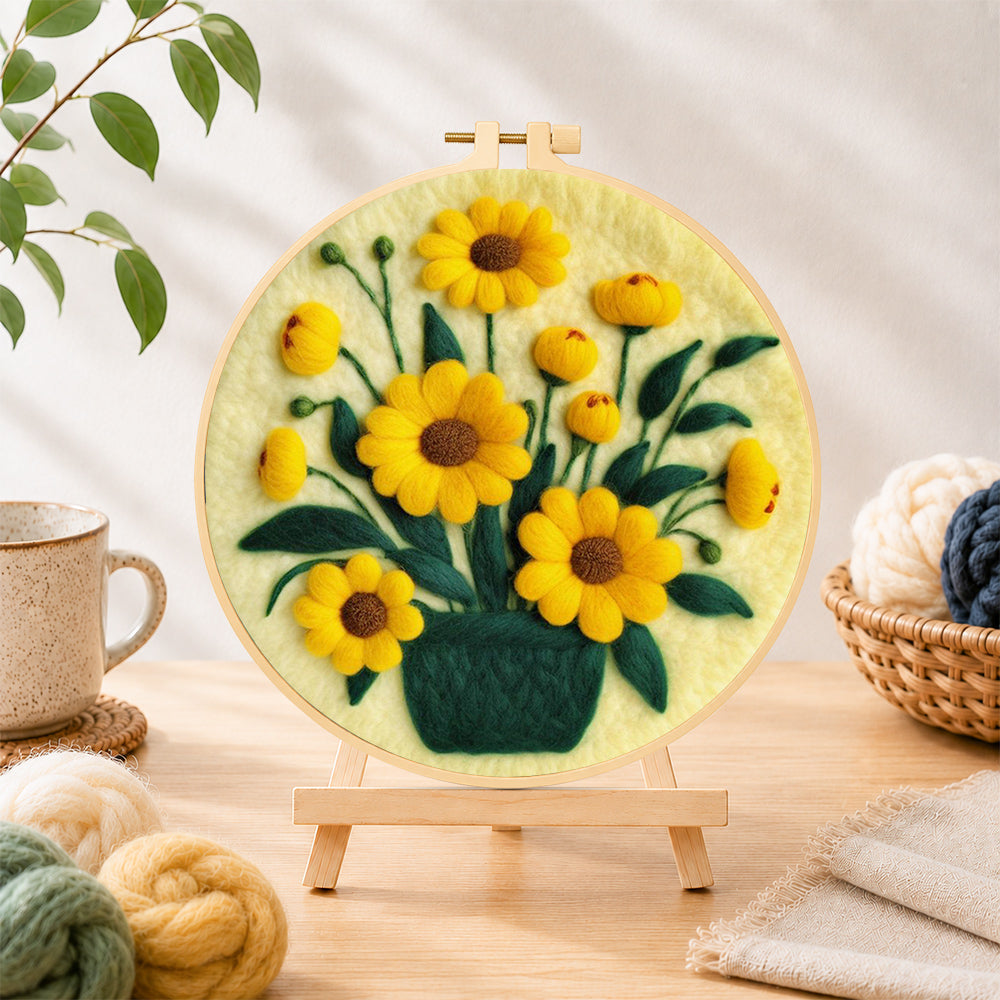 Finished yellow daisies in dark green vase needle felting displayed on a wooden easel