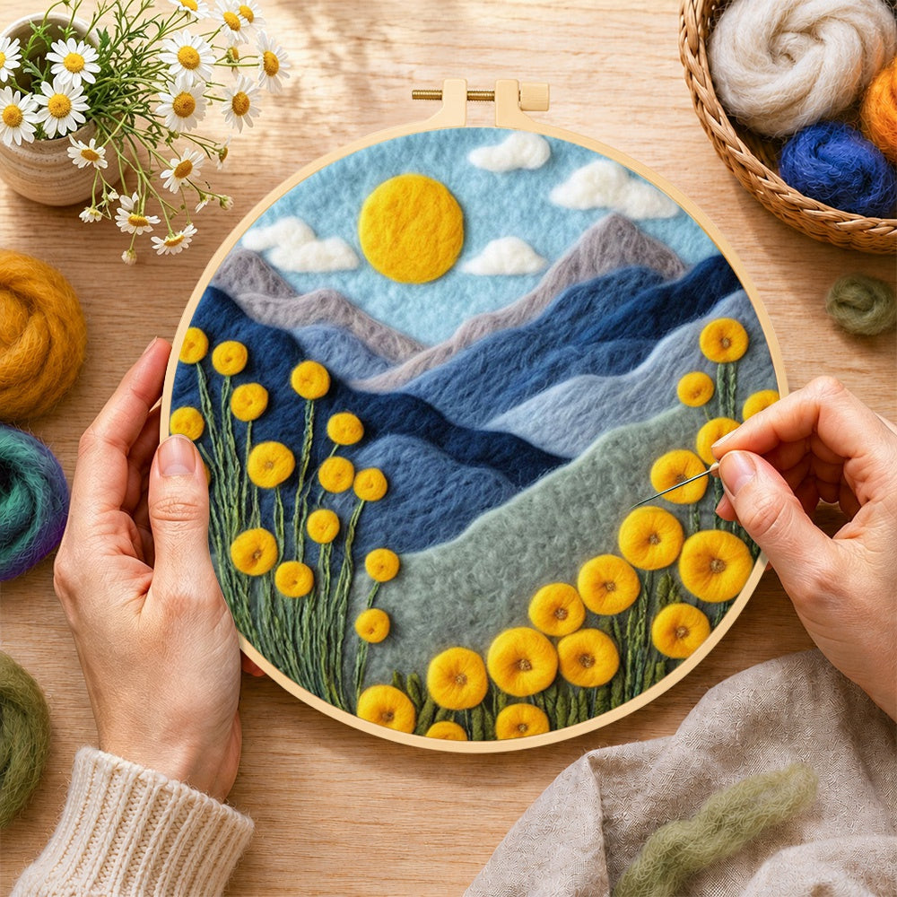 Creating the yellow flowers and blue mountains wool painting by hand with a felting needle