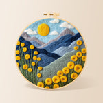 Yellow flowers and blue mountains needle felting kit for beginners with a round wooden frame