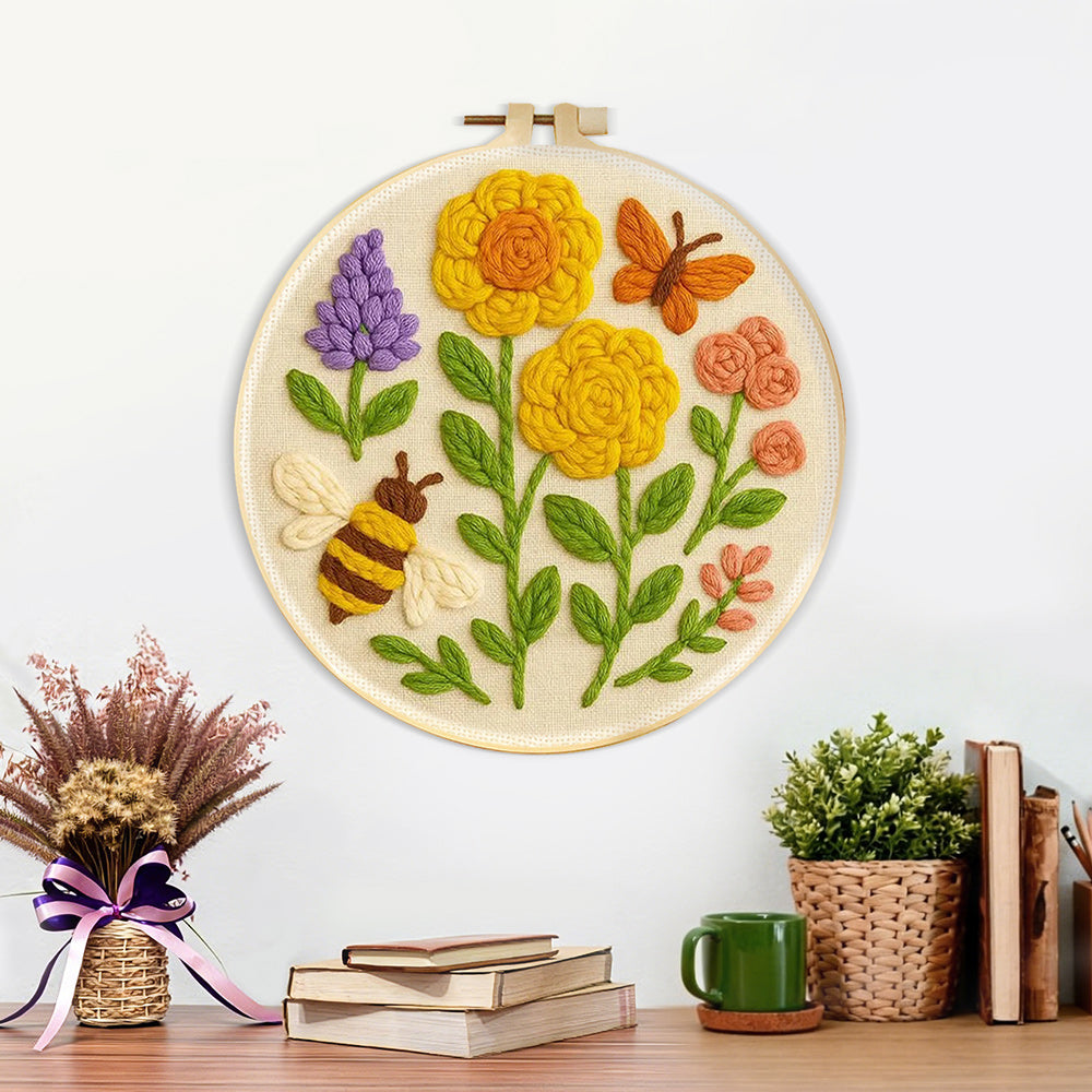 Finished yellow flowers, butterfly and bee artwork displayed on a wall