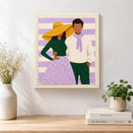 Finished yellow hat lady and scarf man artwork displayed on a wall