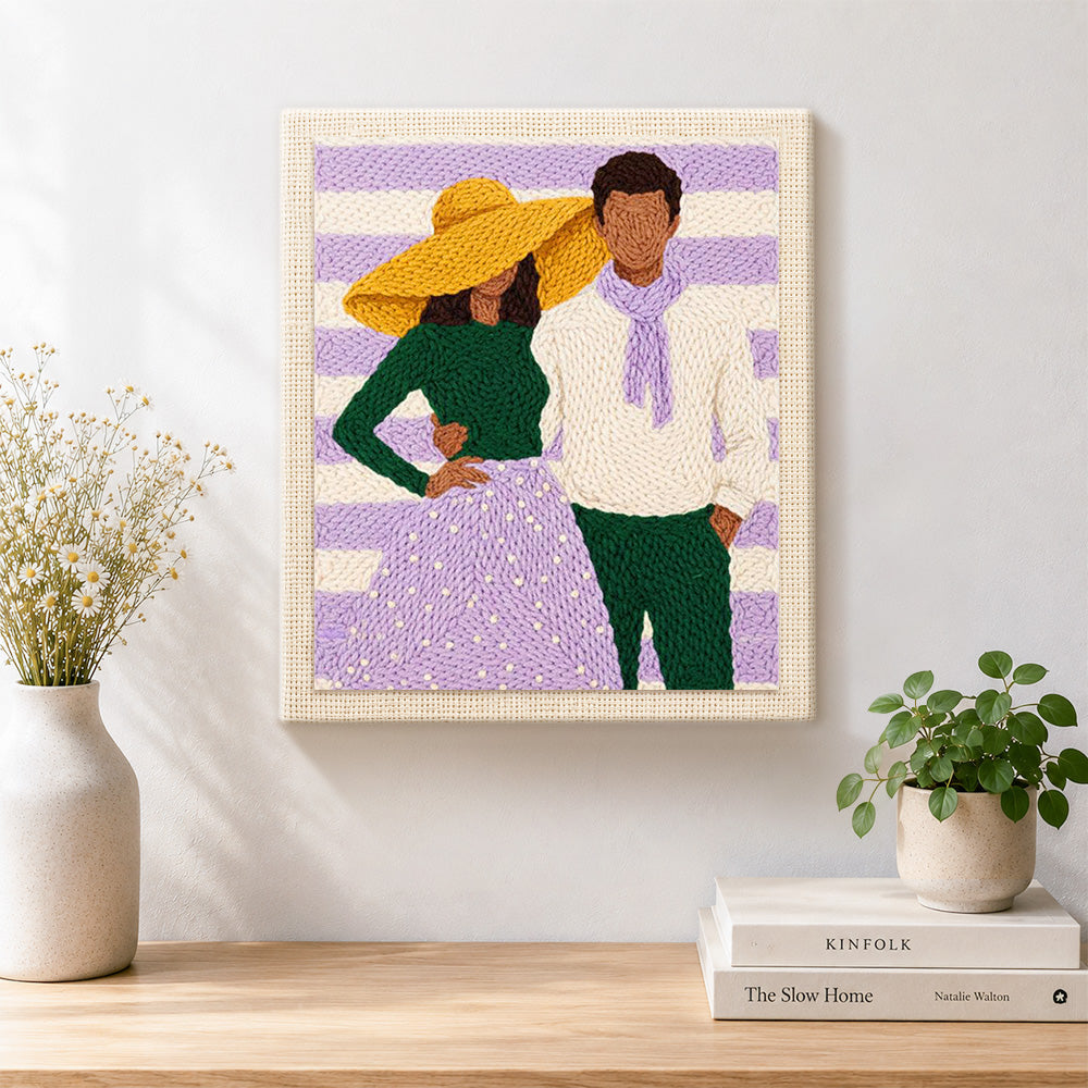 Finished yellow hat lady and scarf man artwork displayed on a wall
