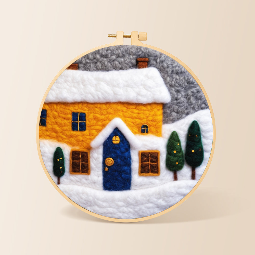 Yellow house and snowy ground needle felting kit for beginners with a round wooden frame