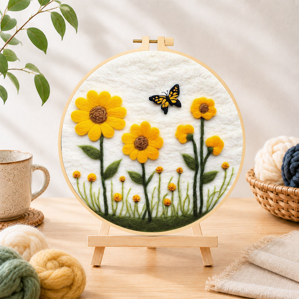 Finished yellow sunflowers with butterfly needle felting displayed on a wooden easel