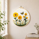 Yellow sunflowers with butterfly needle felt wall art displayed in a bright home interior
