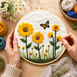 Creating the yellow sunflowers with butterfly wool painting by hand with a felting needle