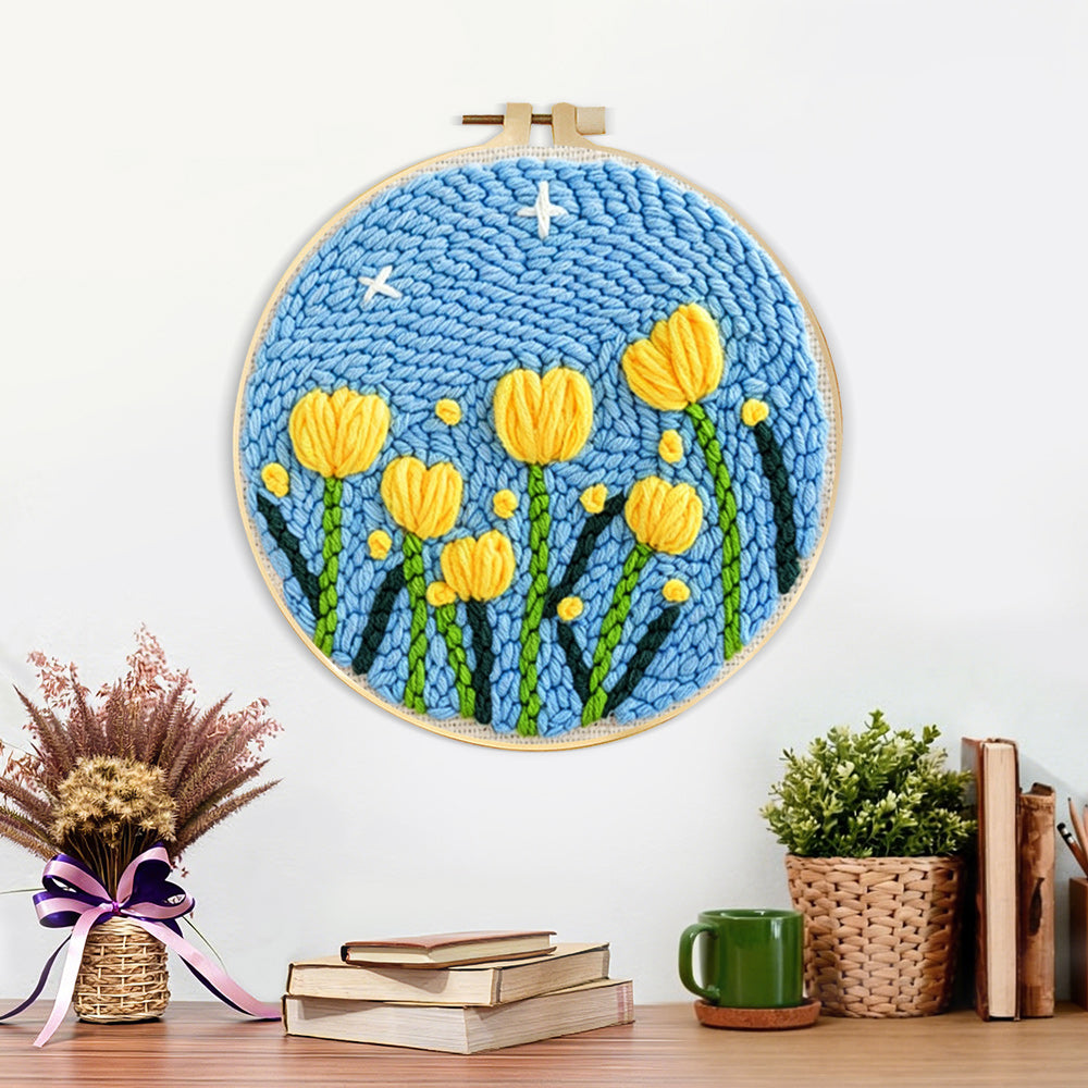 Finished yellow tulips under starry sky artwork displayed on a wall