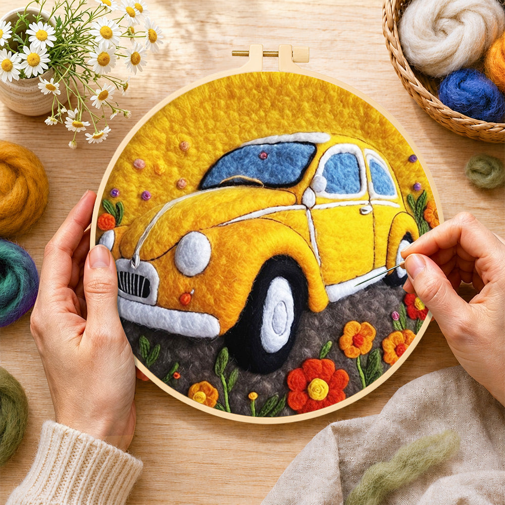 Creating the yellow vintage car wool painting by hand with a felting needle