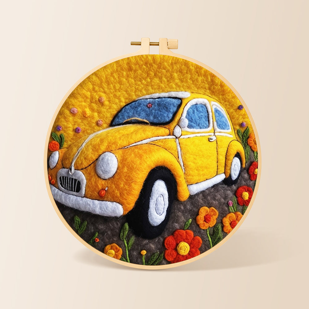 Yellow vintage car needle felting kit for beginners with a round wooden frame